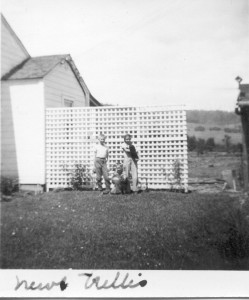 Holmes, Bill and Mary in front of the new trellis.