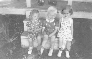 Mary,Holmes and a friend on the stoop in Woodbine, 1940