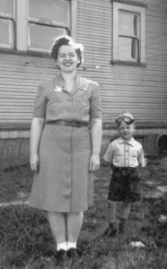 Mom and William outside the flat July 1945 -- coal shoot is behind them