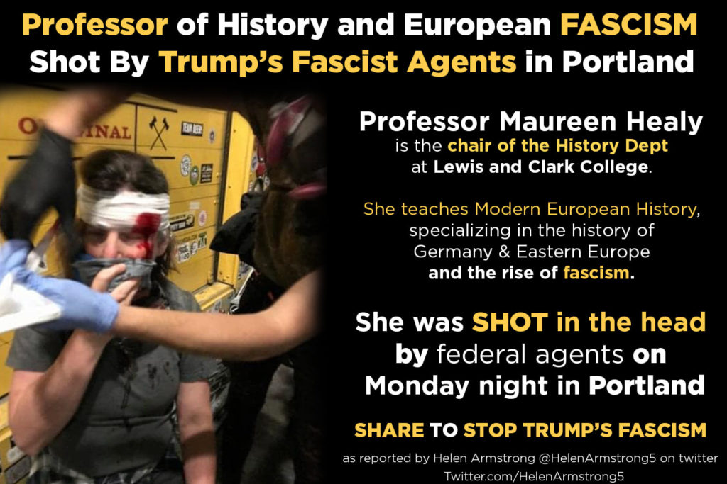 Professor Maureen Healy being cared for after injured by federal agents at Portland, Oregon resister protest